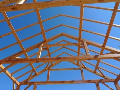 An image showing how a Queen Post Truss is built for a residential building