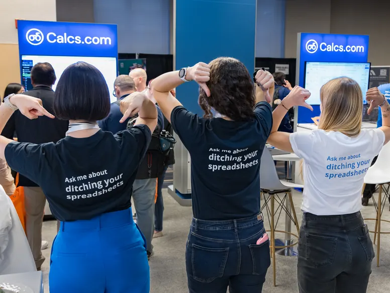 Three Calcs.com team members showing the backs of their shirts, which read ask me about ditching your spreadsheets